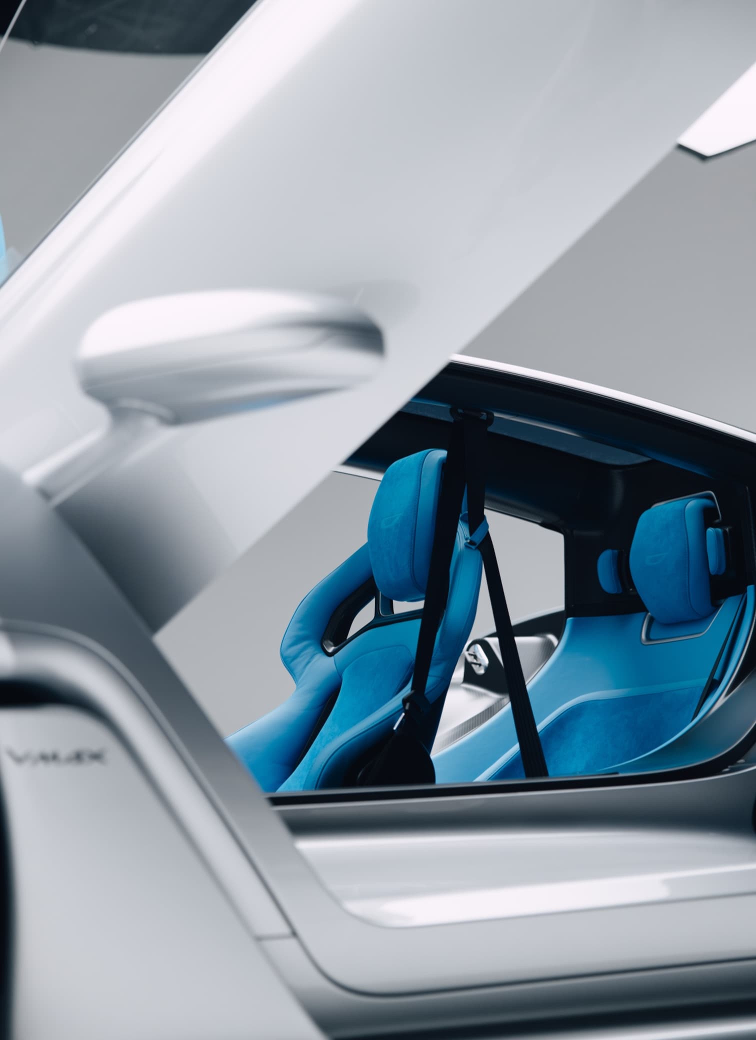 21C cockpit through the open canopy — blue seats and central driving position