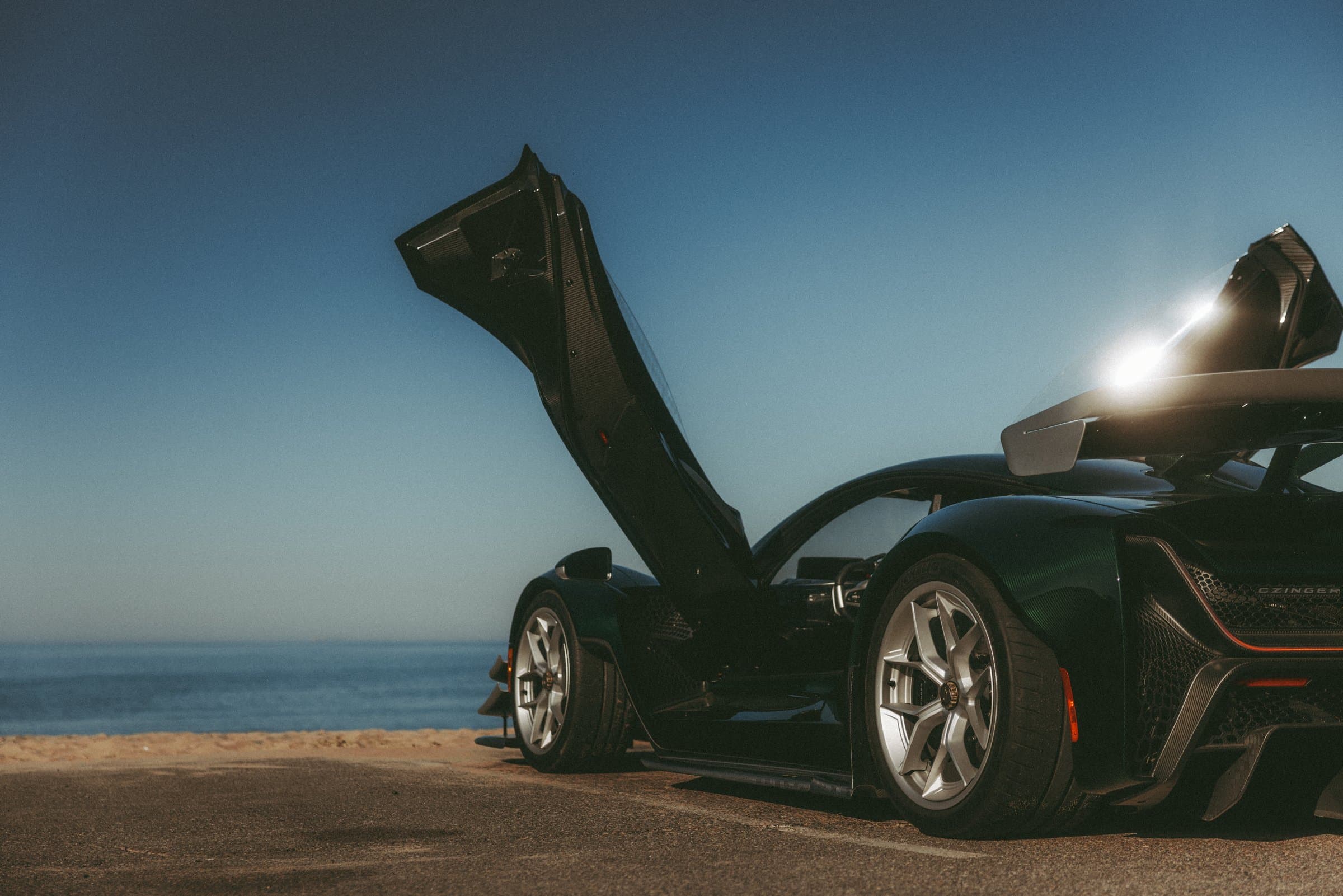 21C with doors raised on the Pacific Coast Highway