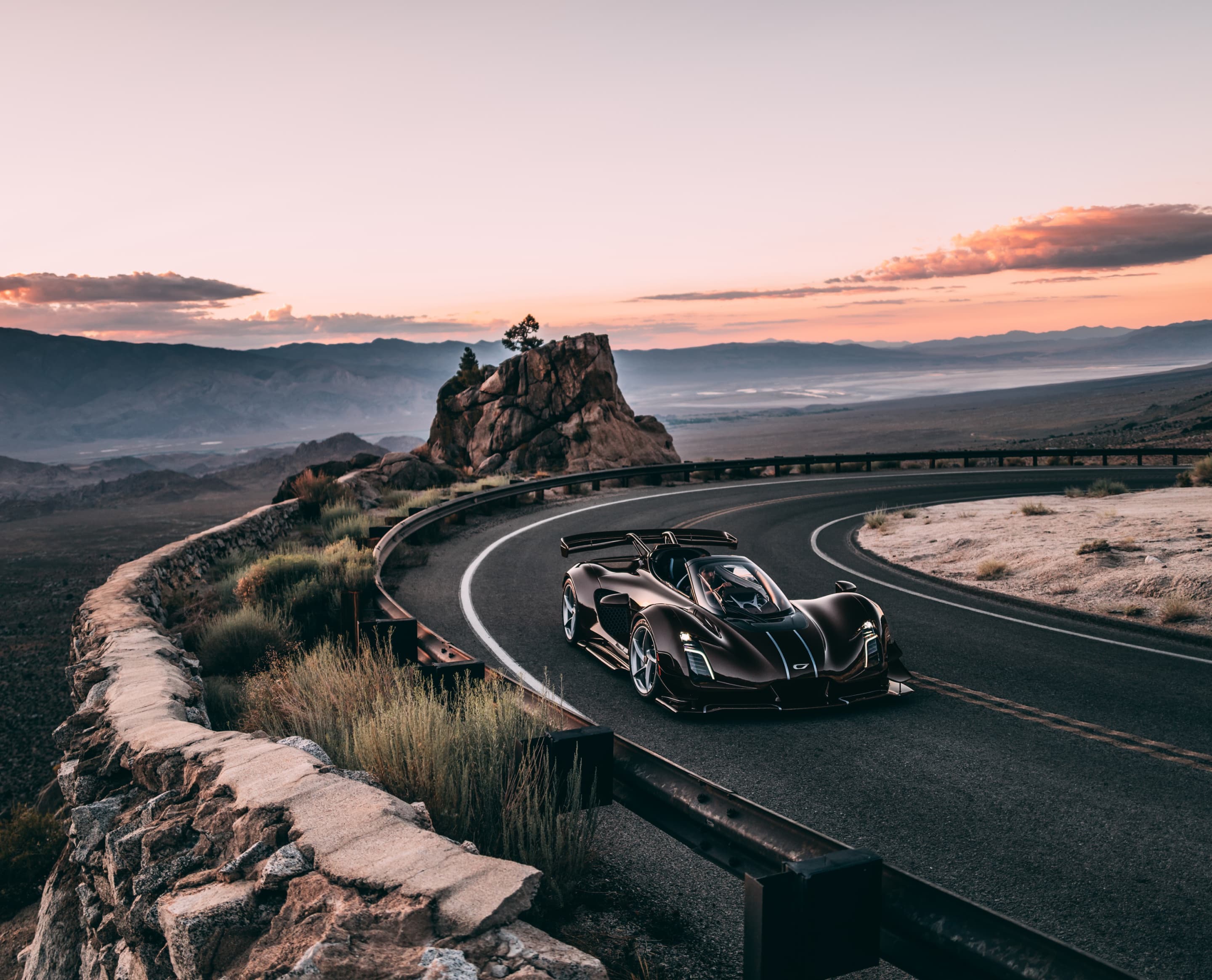 21C Spyder driving open-top at speed