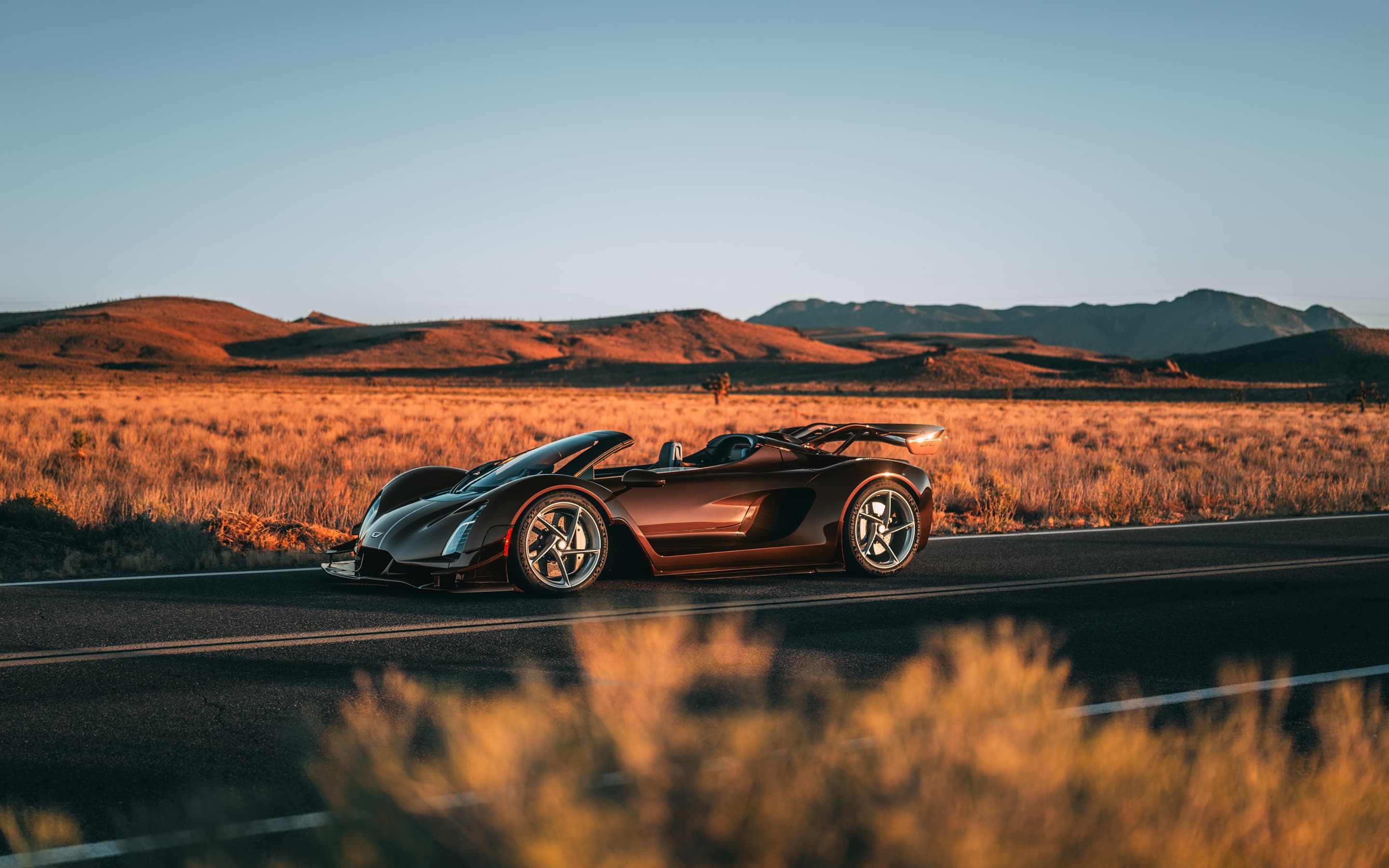 Czinger 21C Spyder on a desert road at golden hour