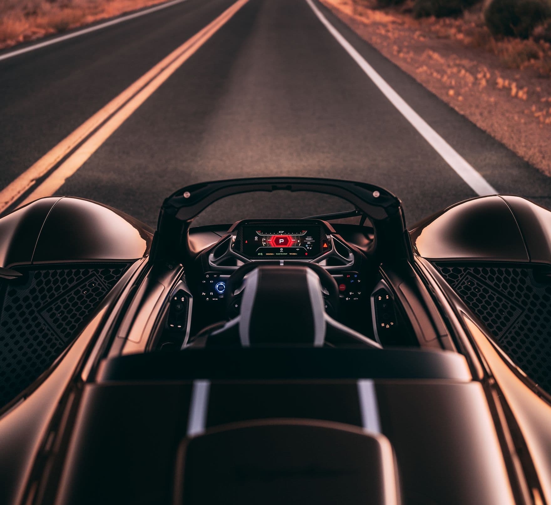 NeuralNode cockpit from the driver's seat on an open desert road