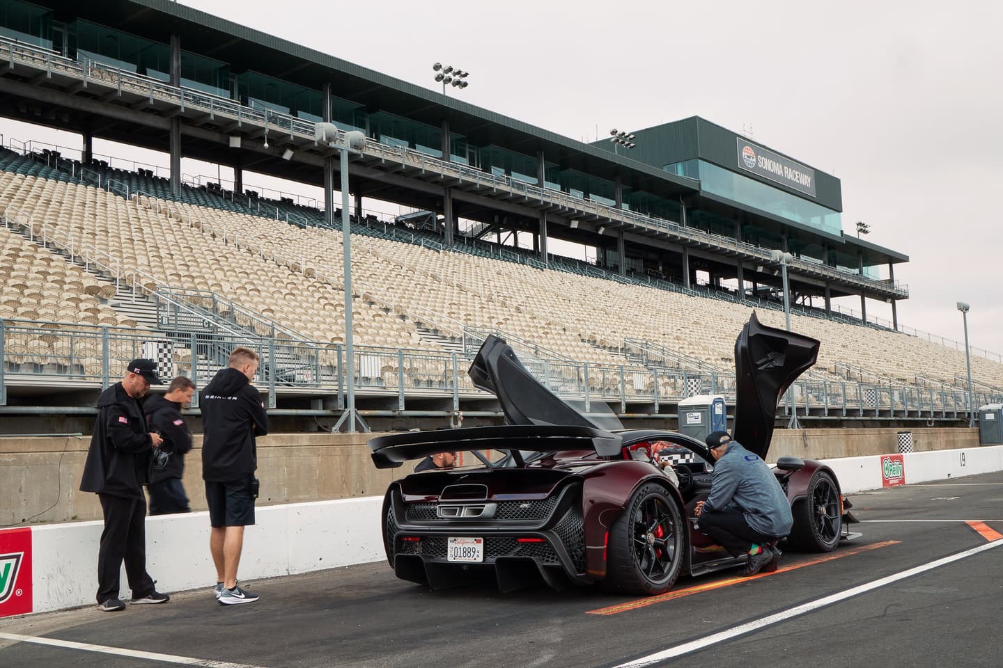 Technicians with the 21C in the pit lane