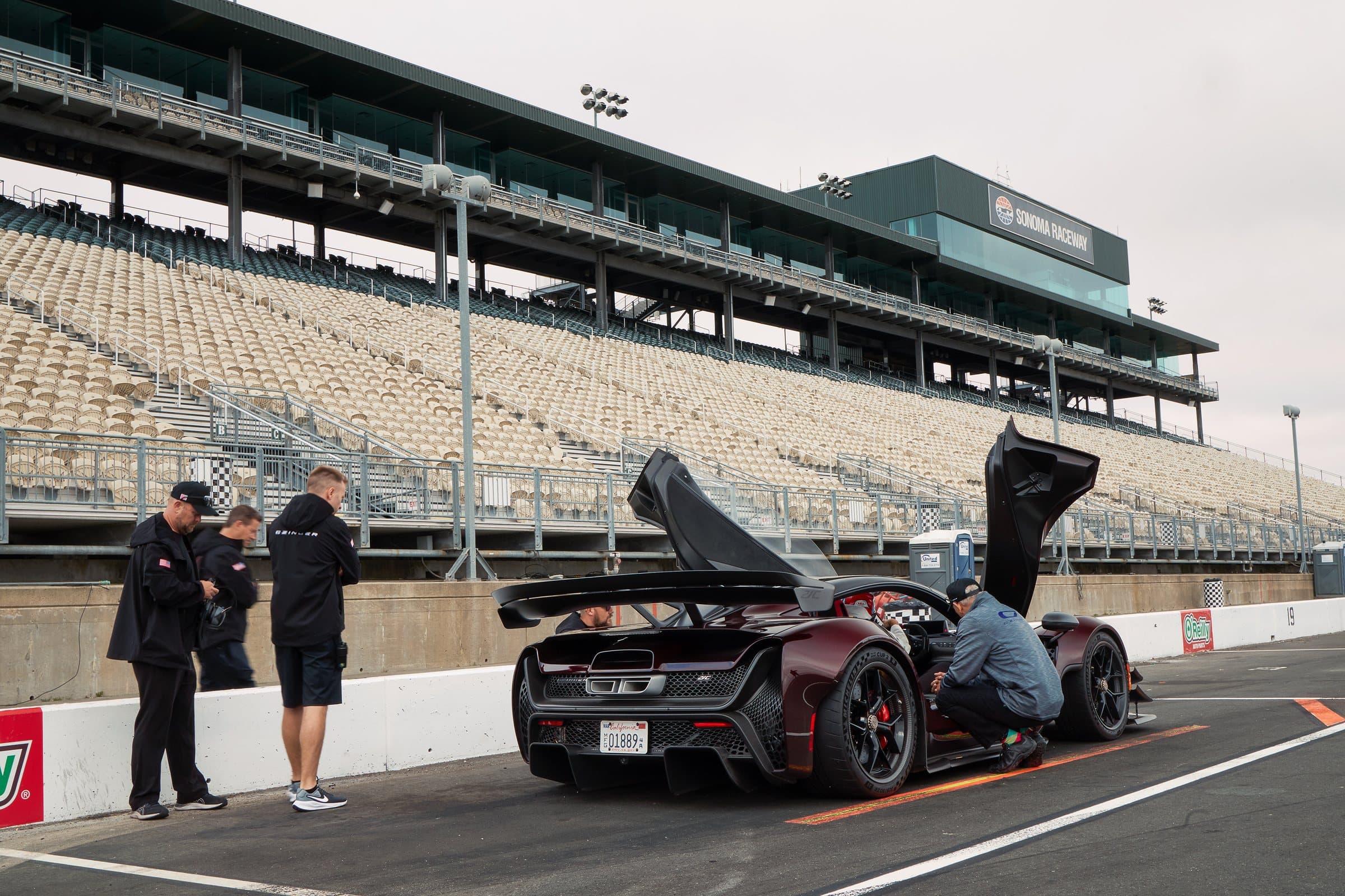 Technicians with the 21C in the pit lane